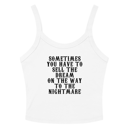 "Sometimes you have to sell the dream on the way to the nightmare" printed on a solid white blend women's micro-rib tanktop laying on a flat surface amongst sunglasses and shorts