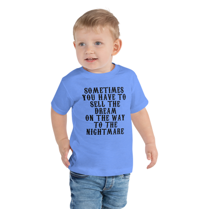 "Sometimes you have to sell the dream on the way to the nightmare" printed on a heather columbia blue toddler short sleeve tee worn by a male