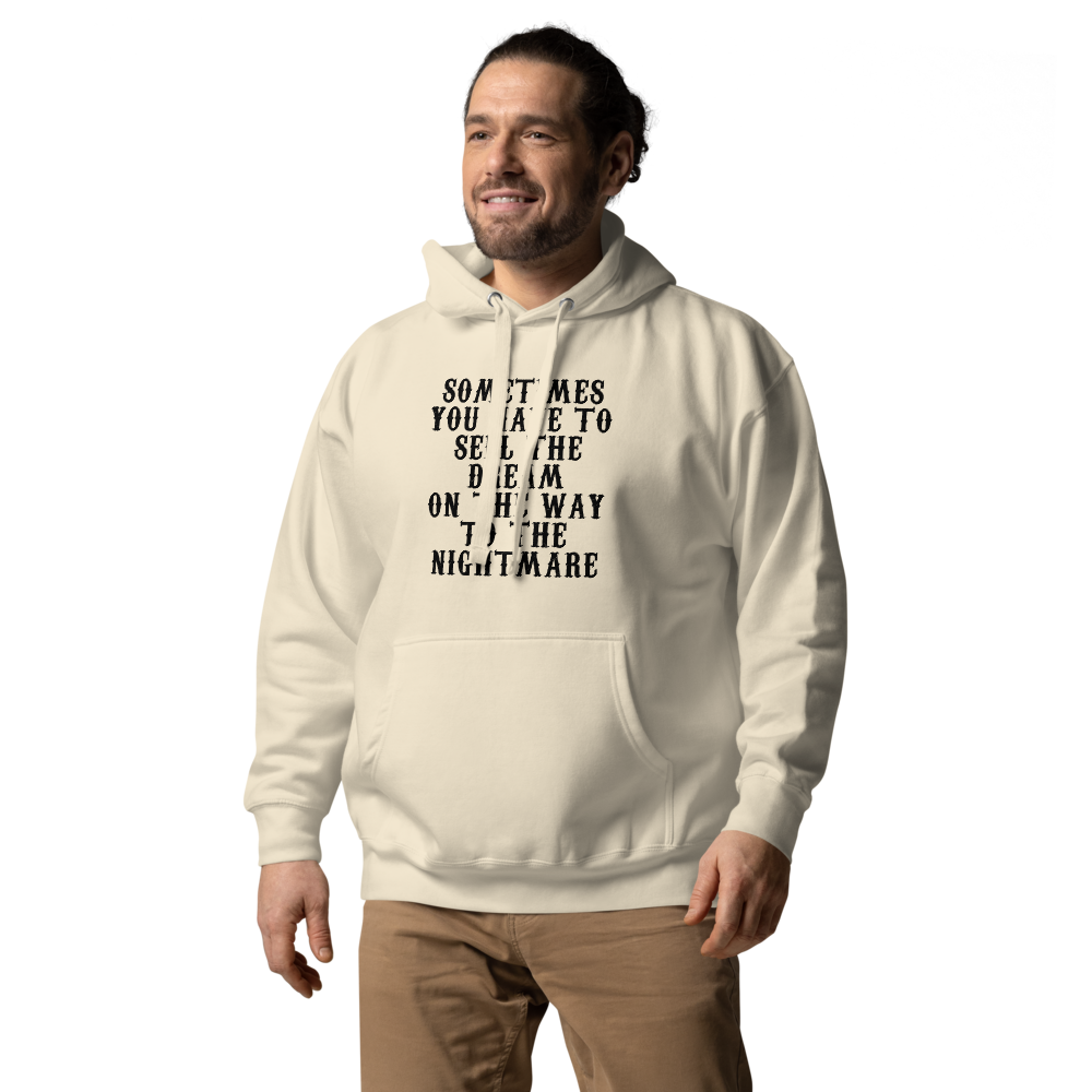 "Sometimes you have to sell the dream on the way to the nightmare" printed on a bone unisex hoodie worn by a male
