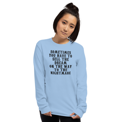 "Sometimes you have to sell the dream on the way to the nightmare" printed on a light blue men's long sleeve shirt worn by a female