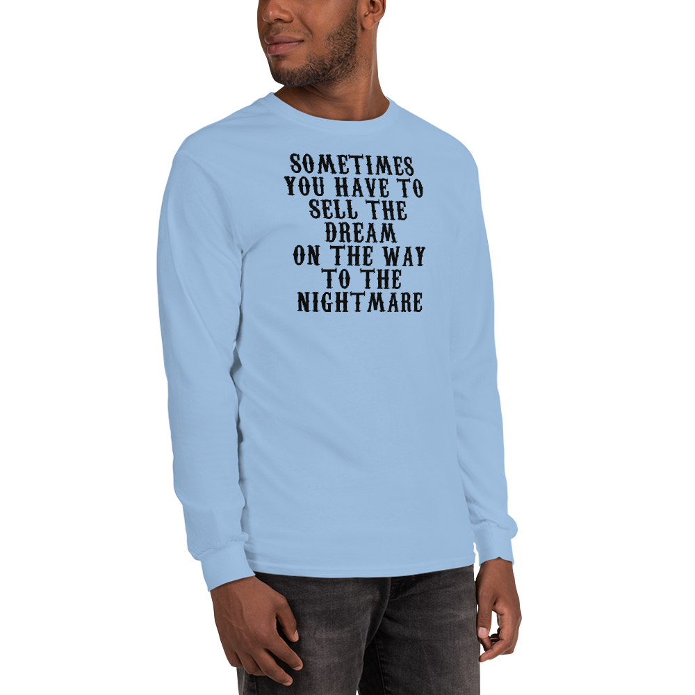"Sometimes you have to sell the dream on the way to the nightmare" printed on a light blue men's long sleeve shirt worn by a male