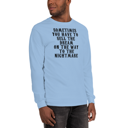 "Sometimes you have to sell the dream on the way to the nightmare" printed on a light blue men's long sleeve shirt worn by a male