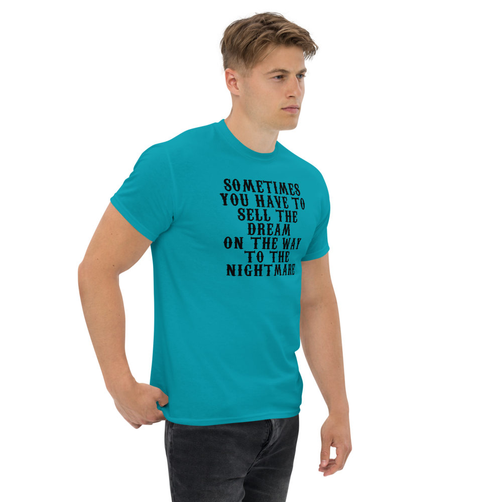 "Sometimes you have to sell the dream on the way to the nightmare" printed on a tropical blue unisex classic tee worn by a male