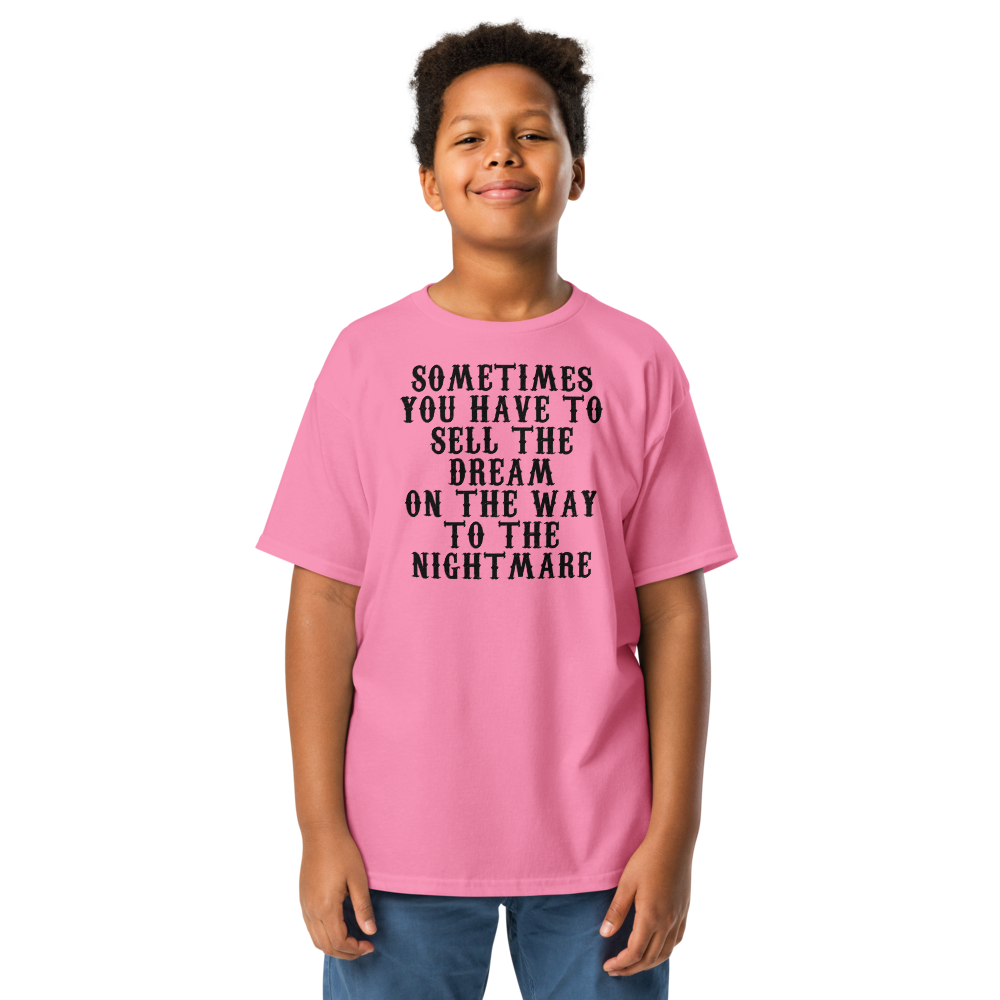 "Sometimes you have to sell the dream on the way to the nightmare" printed on a azalea youth classic tee worn by a male