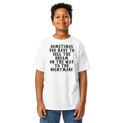 "Sometimes you have to sell the dream on the way to the nightmare" printed on a white youth classic tee worn by a male
