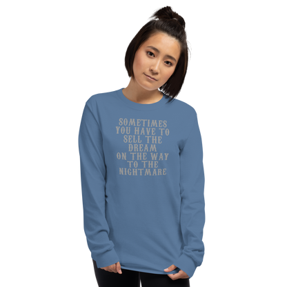 "Sometimes you have to sell the dream on the way to the nightmare" printed on a indigo blue men's long sleeve shirt worn by a female