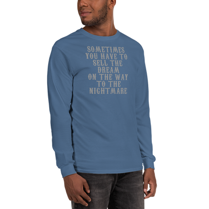 "Sometimes you have to sell the dream on the way to the nightmare" printed on a indigo blue men's long sleeve shirt worn by a male