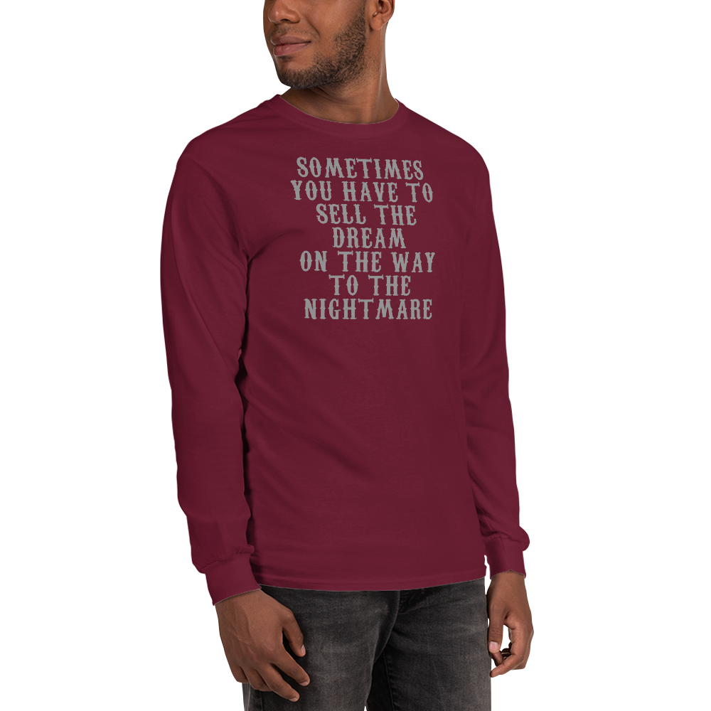 "Sometimes you have to sell the dream on the way to the nightmare" printed on a maroon men's long sleeve shirt worn by a male