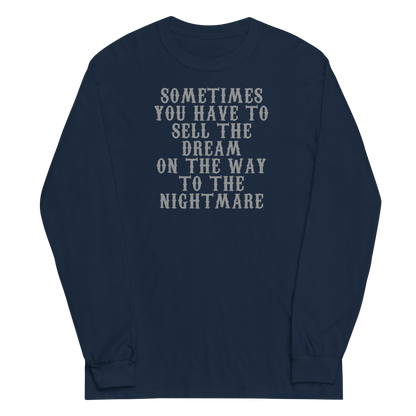 "Sometimes you have to sell the dream on the way to the nightmare" printed on a navy men's long sleeve shirt laying on a flat surface