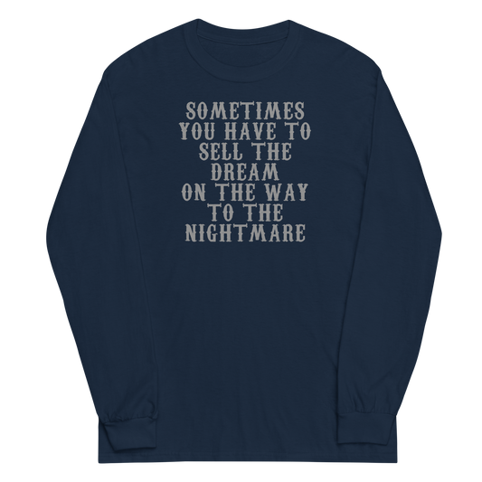 "Sometimes you have to sell the dream on the way to the nightmare" printed on a navy men's long sleeve shirt laying on a flat surface