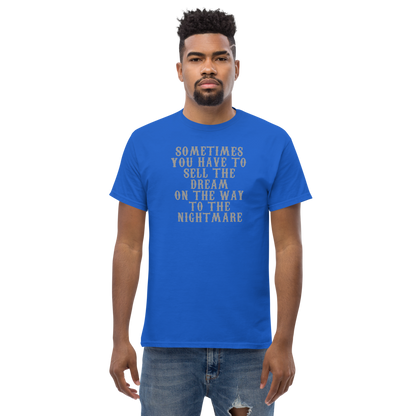 "Sometimes you have to sell the dream on the way to the nightmare" printed on a royal unisex classic tee worn by a male