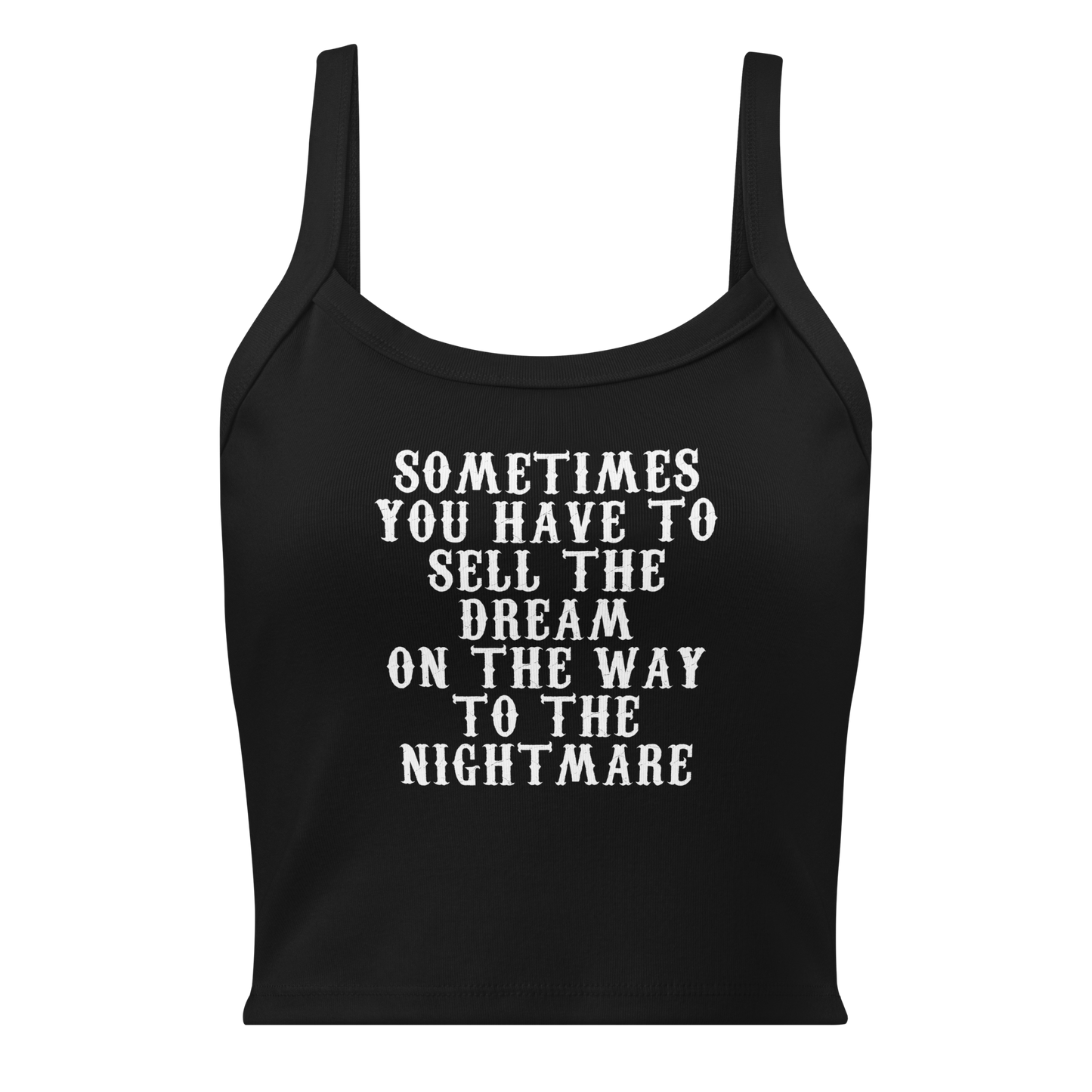 "Sometimes you have to sell the dream on the way to the nightmare" printed on a solid black blend women's micro-rib tanktop laying on a flat surface