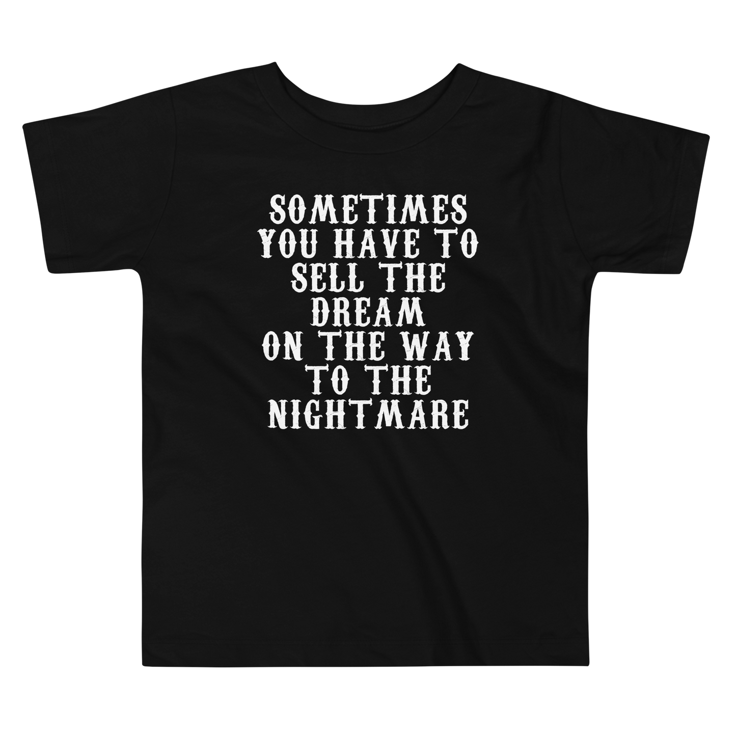 "Sometimes you have to sell the dream on the way to the nightmare" printed on a black toddler short sleeve tee laying on a flat surface