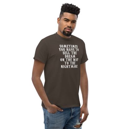 "Sometimes you have to sell the dream on the way to the nightmare" printed on a dark chocolate unisex classic tee worn by a male