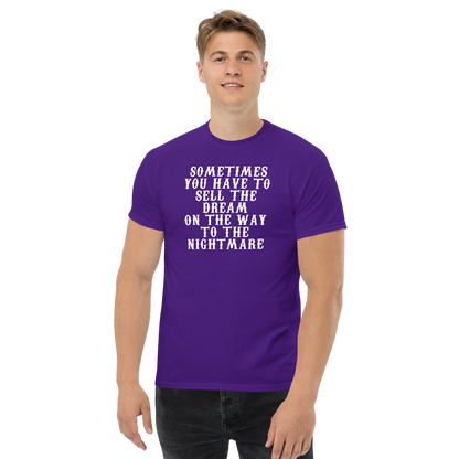 "Sometimes you have to sell the dream on the way to the nightmare" printed on a purple unisex classic tee worn by a male