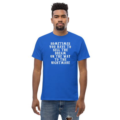 "Sometimes you have to sell the dream on the way to the nightmare" printed on a royal unisex classic tee worn by a male