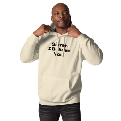 "Sister, I Believe You!" printed on a bone unisex hoodie worn by a male