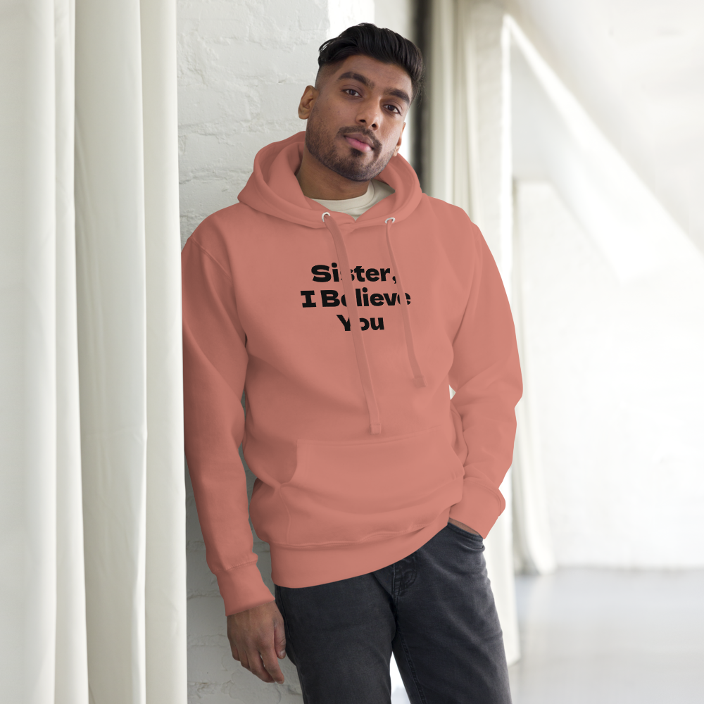 "Sister, I Believe You!" printed on a dusty rose unisex hoodie worn by a male