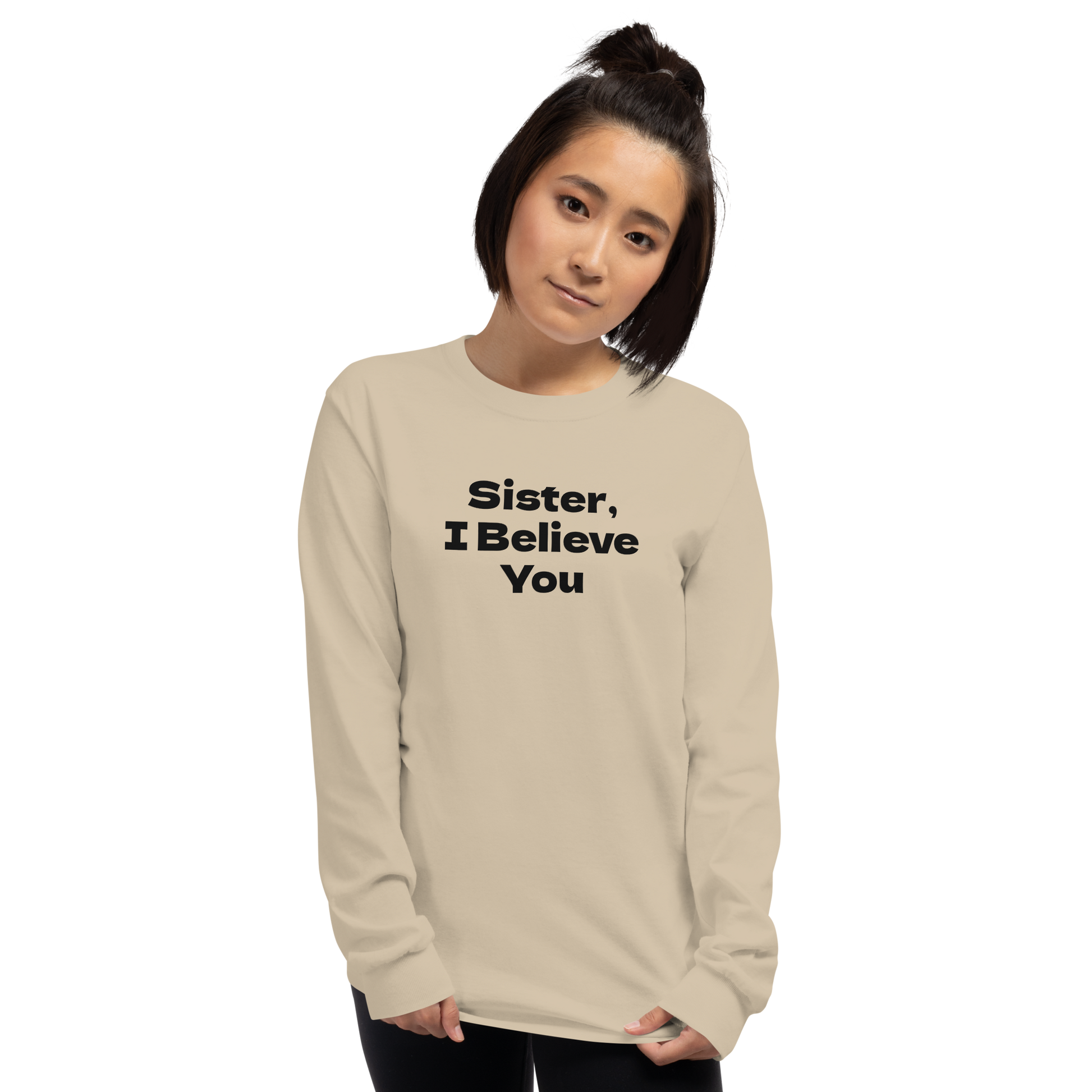 "Sister, I Believe You!" printed on a sand men's long sleeve shirt worn by a female