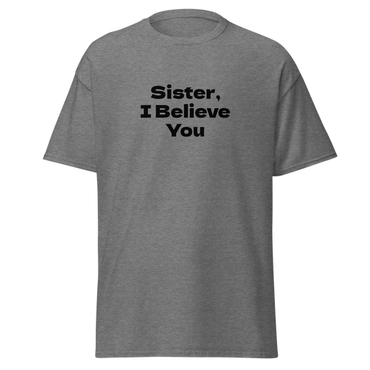 "Sister, I Believe You!" printed on a graphite heather unisex classic tee laying on a flat surface