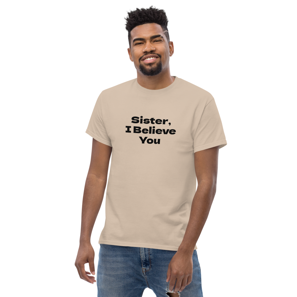 "Sister, I Believe You!" printed on a sand unisex classic tee worn by a male