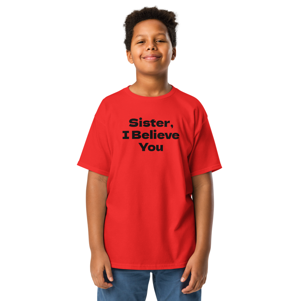 "Sister, I Believe You!" printed on a red youth classic tee worn by a male