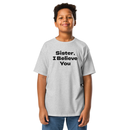 "Sister, I Believe You!" printed on a sport grey youth classic tee worn by a male