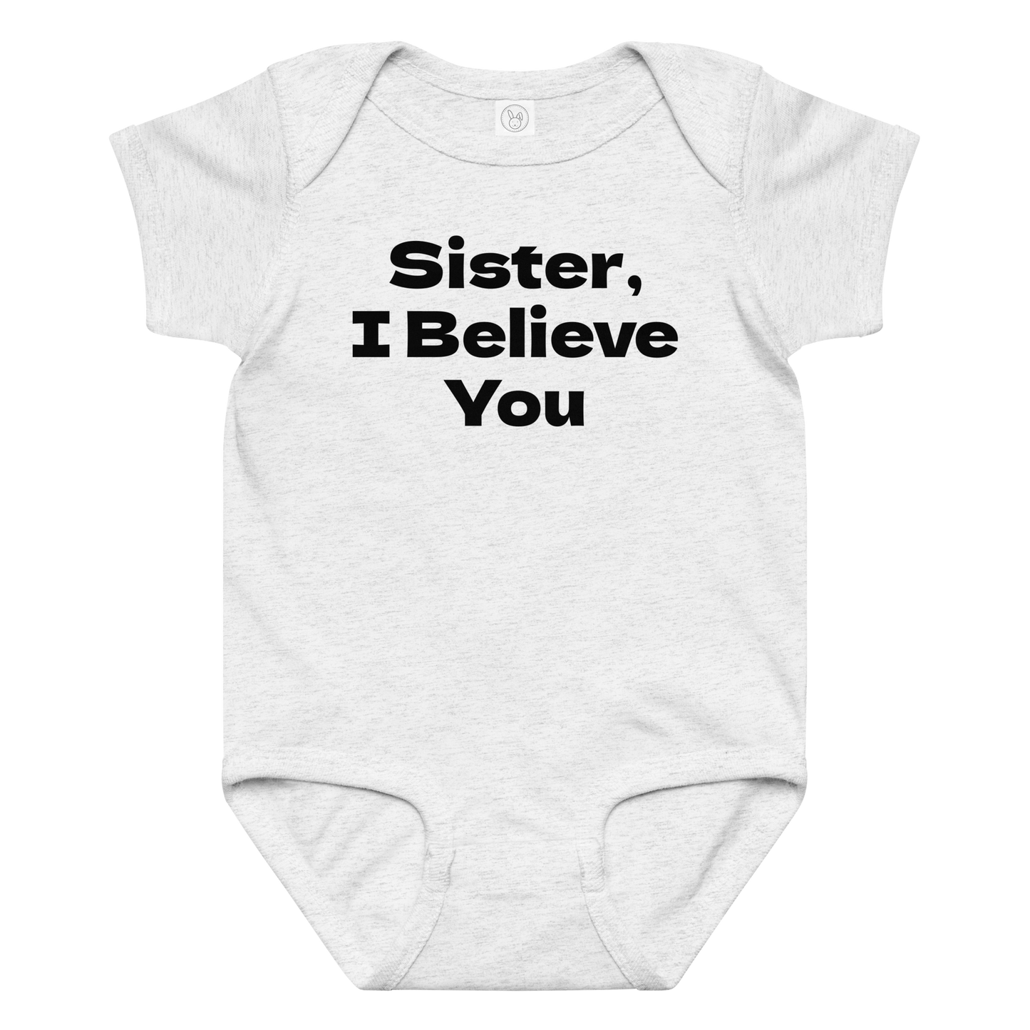 "Sister, I Believe You!" printed on a ash baby jersey bodysuit laying on a flat surface amongst other clothes