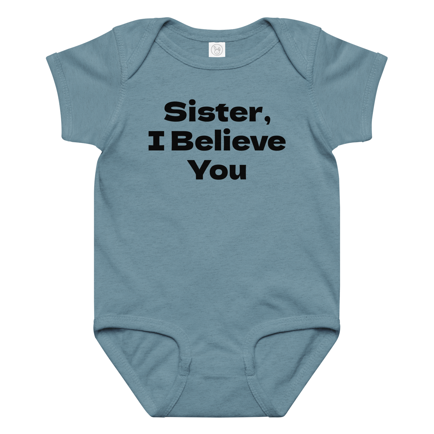 "Sister, I Believe You!" printed on a vintage indigo baby jersey bodysuit laying on a flat surface amongst other clothes