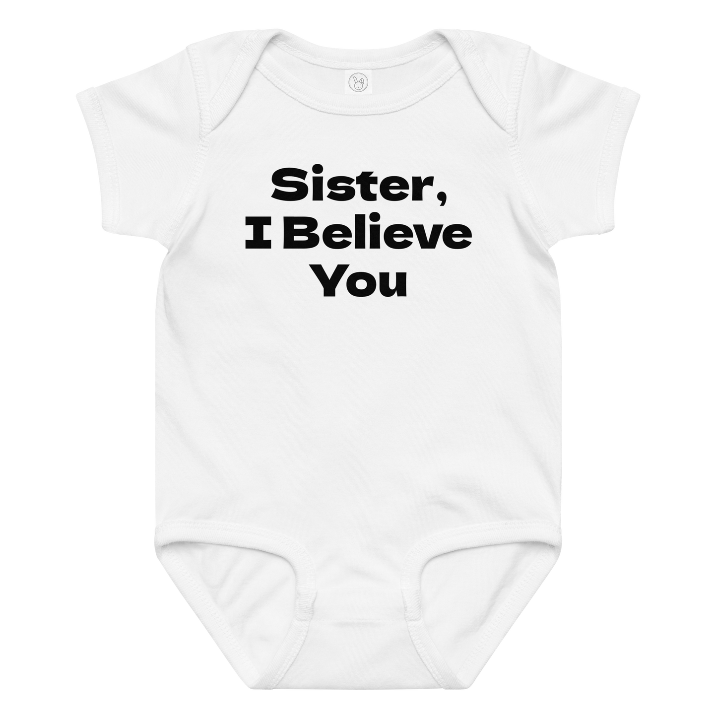 "Sister, I Believe You!" printed on a white baby jersey bodysuit laying on a flat surface amongst other clothes