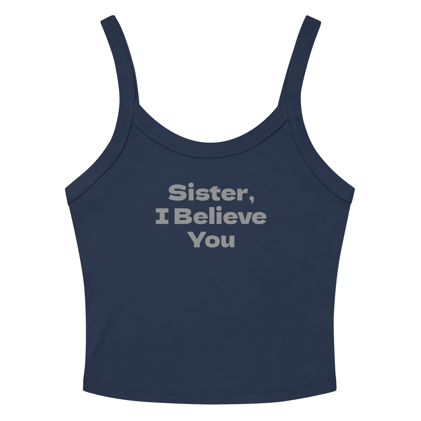 "Sister, I Believe You!" printed on a solid navy blend women's micro-rib tanktop laying on a flat surface amongst sunglasses and shorts