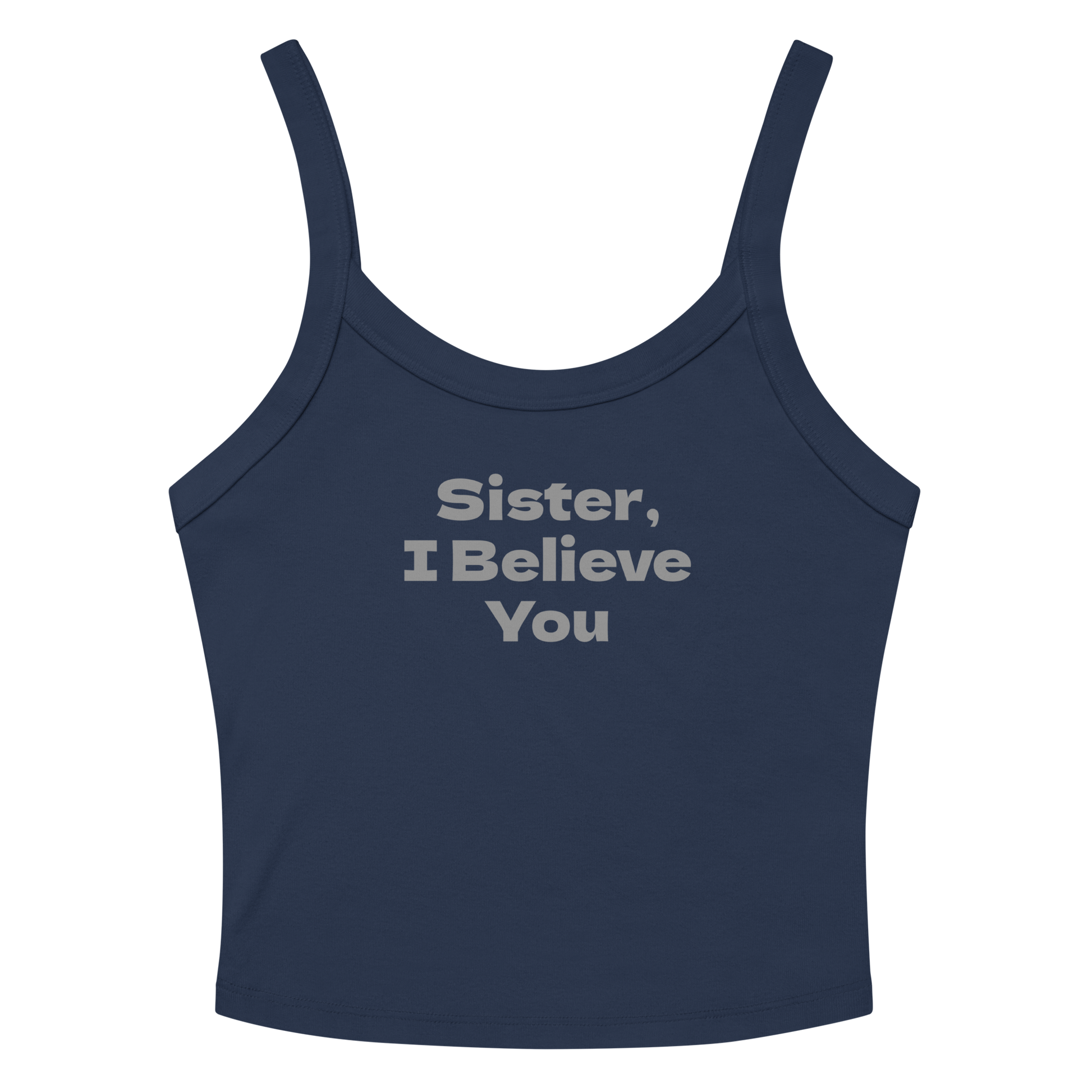 "Sister, I Believe You!" printed on a solid navy blend women's micro-rib tanktop laying on a flat surface amongst sunglasses and shorts
