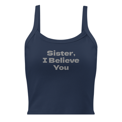 "Sister, I Believe You!" printed on a solid navy blend women's micro-rib tanktop laying on a flat surface