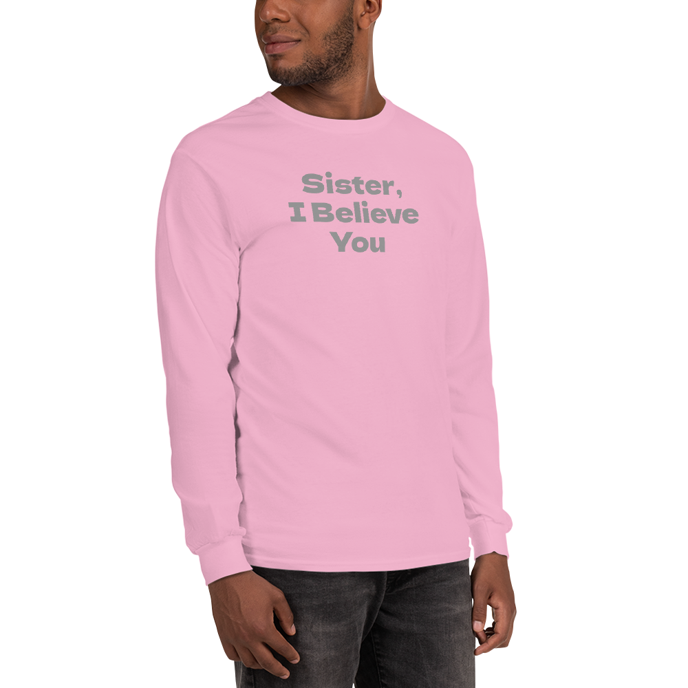 "Sister, I Believe You!" printed on a light pink men's long sleeve shirt worn by a male