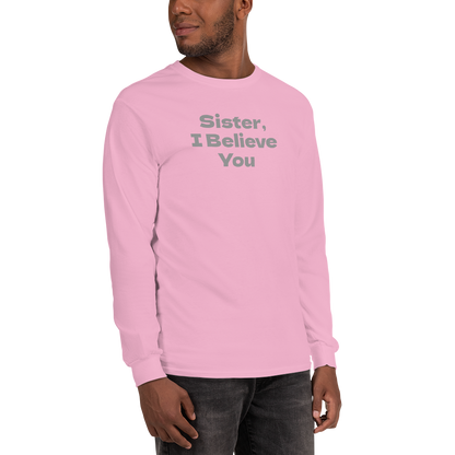 "Sister, I Believe You!" printed on a light pink men's long sleeve shirt worn by a male