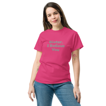 "Sister, I Believe You!" printed on a heliconia unisex classic tee worn by a female