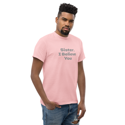 "Sister, I Believe You!" printed on a light pink unisex classic tee worn by a male