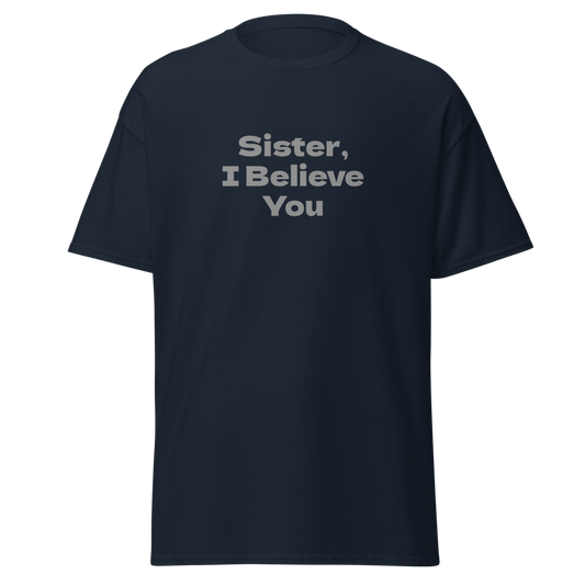 "Sister, I Believe You!" printed on a navy unisex classic tee laying on a flat surface