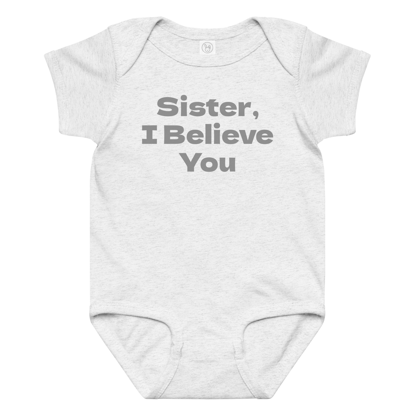 "Sister, I Believe You!" printed on a ash baby jersey bodysuit laying on a flat surface amongst other clothes