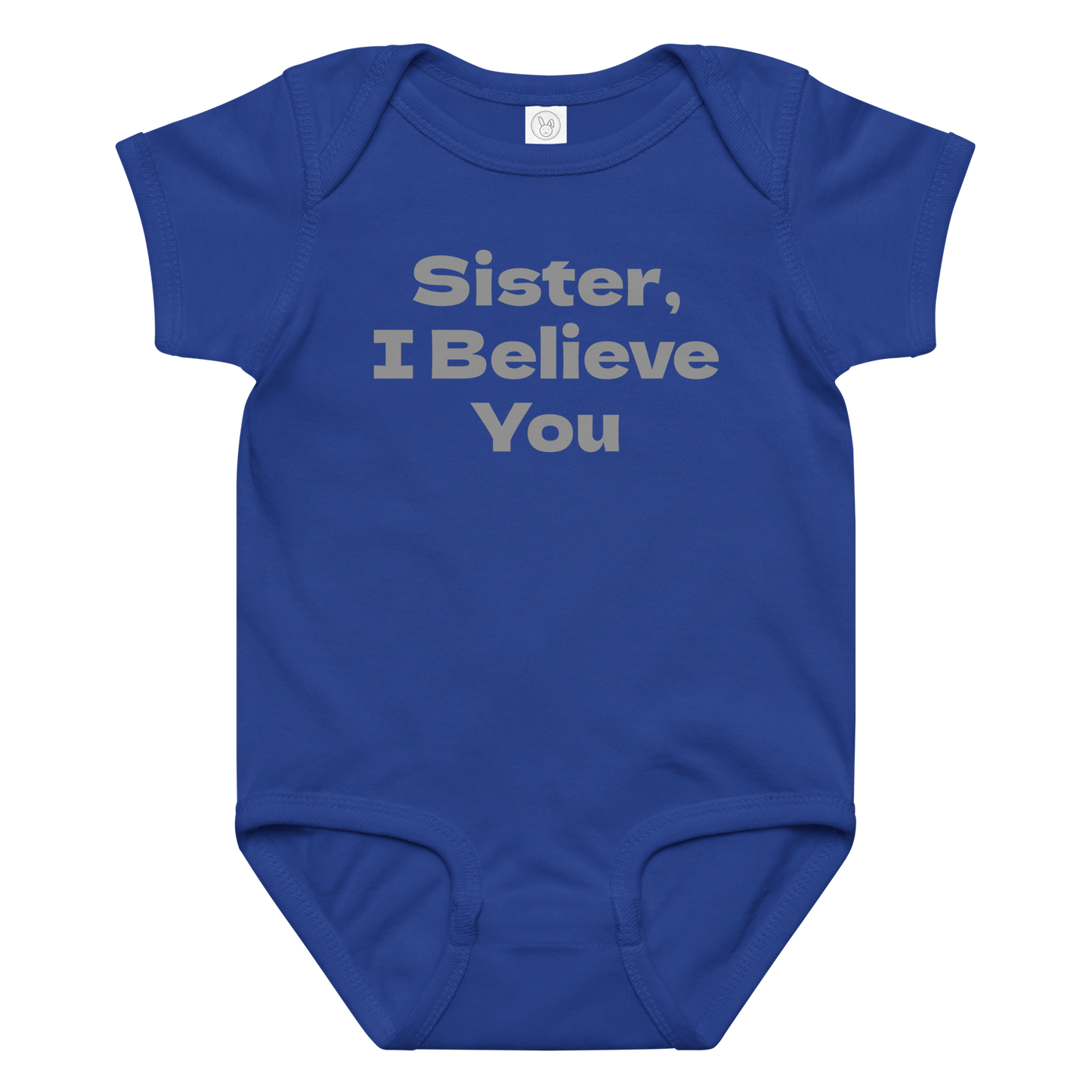 "Sister, I Believe You!" printed on a royal baby jersey bodysuit laying on a flat surface amongst other clothes