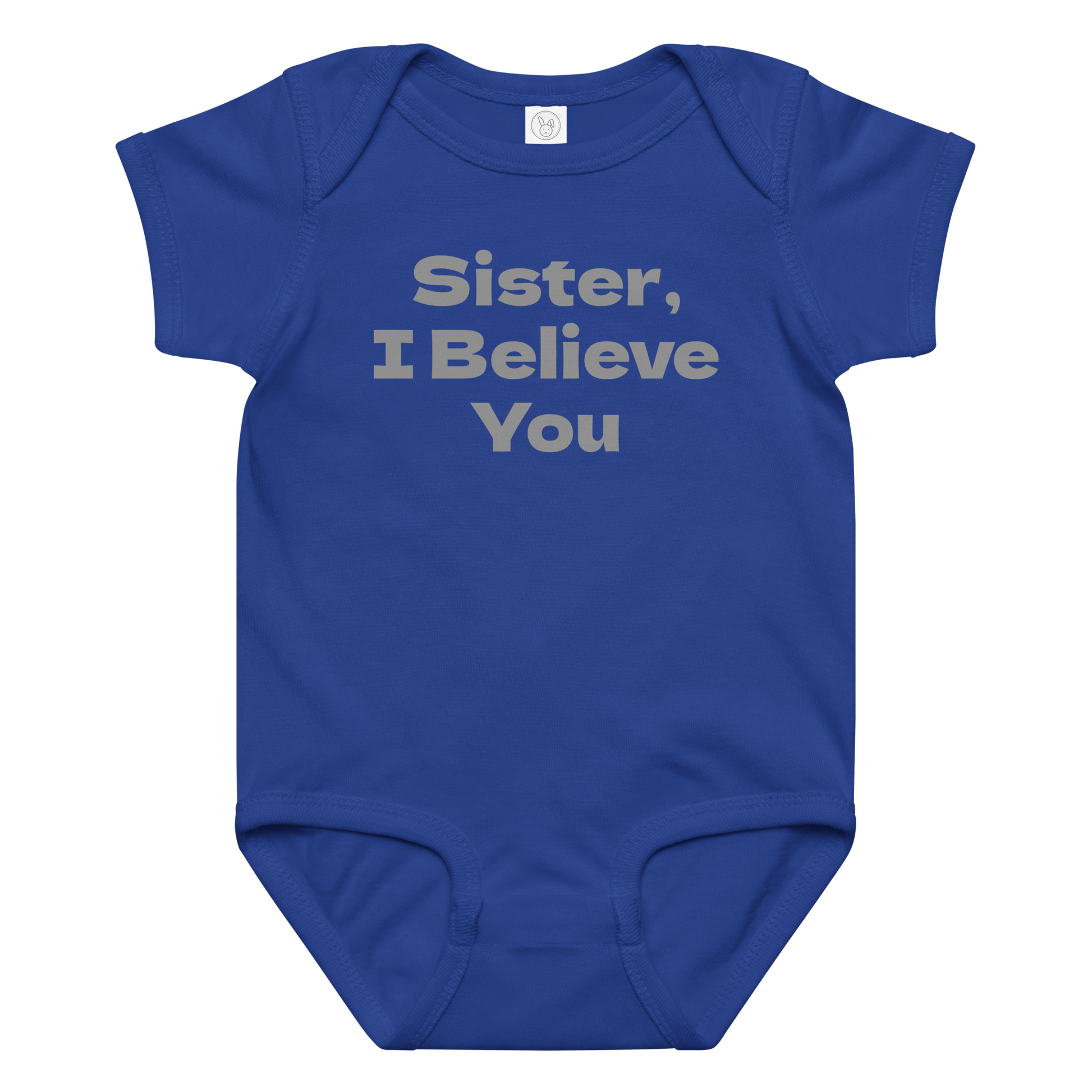 "Sister, I Believe You!" printed on a royal baby jersey bodysuit laying on a flat surface amongst other clothes