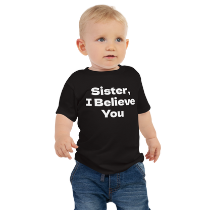 "Sister, I Believe You!" printed on a black baby jersey short sleeve tee worn by a male