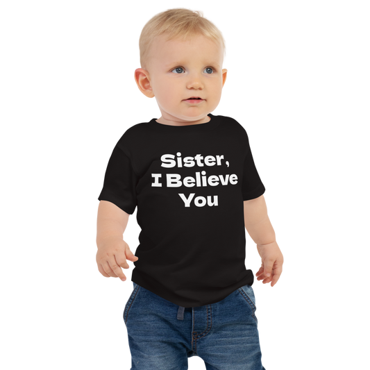 "Sister, I Believe You!" printed on a black baby jersey short sleeve tee worn by a male