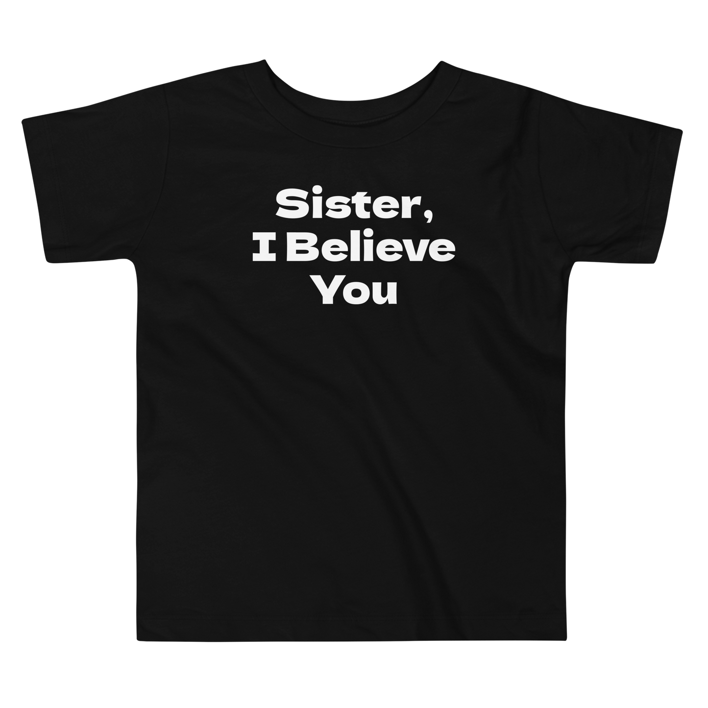 "Sister, I Believe You!" printed on a black toddler short sleeve tee laying on a flat surface