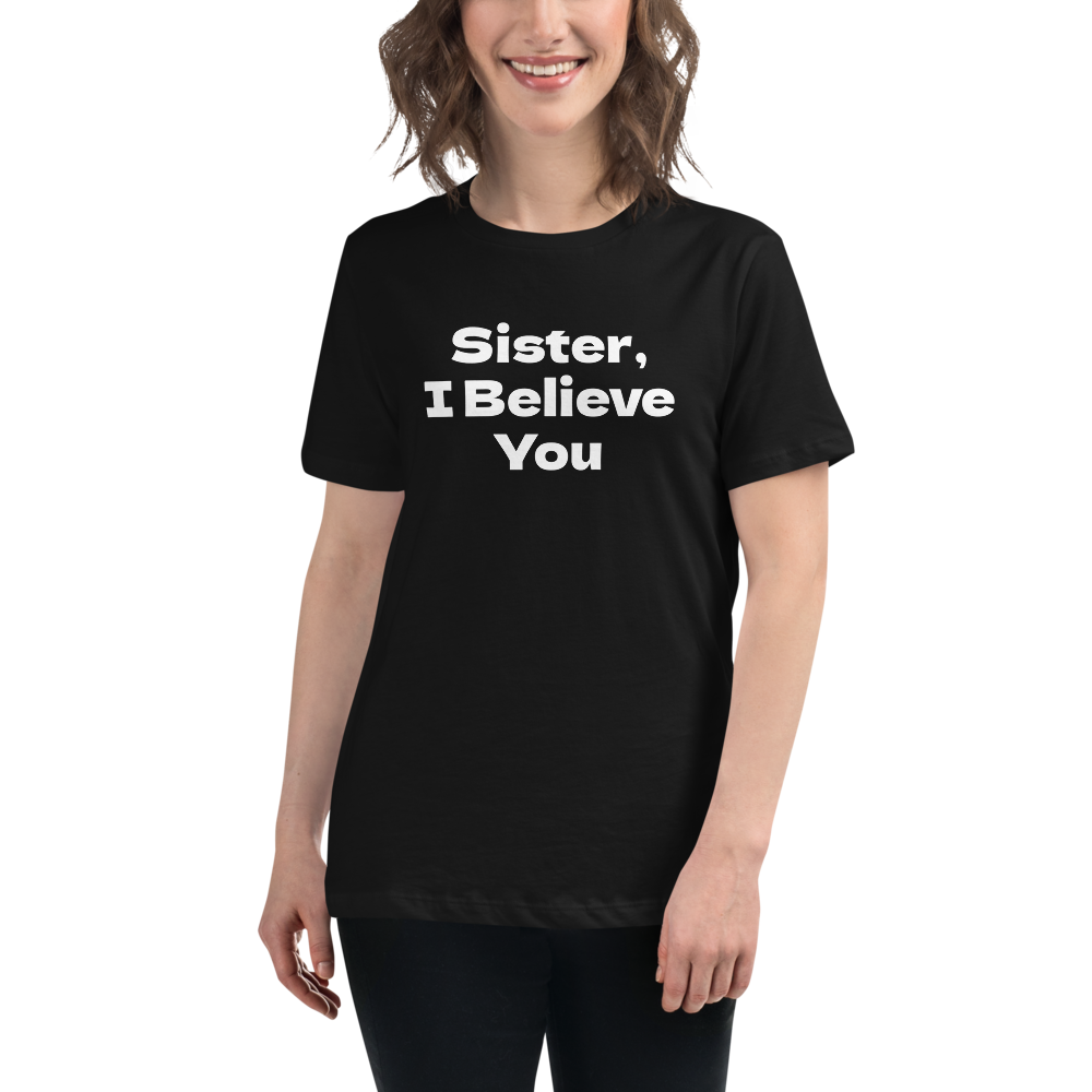 "Sister, I Believe You!" printed on a black women's relaxed t-shirt worn by a female