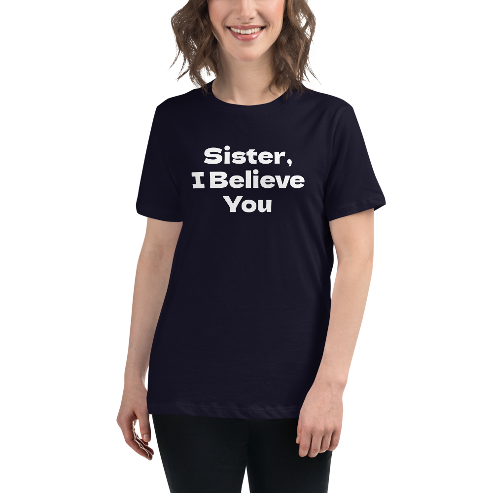 "Sister, I Believe You!" printed on a navy women's relaxed t-shirt worn by a female