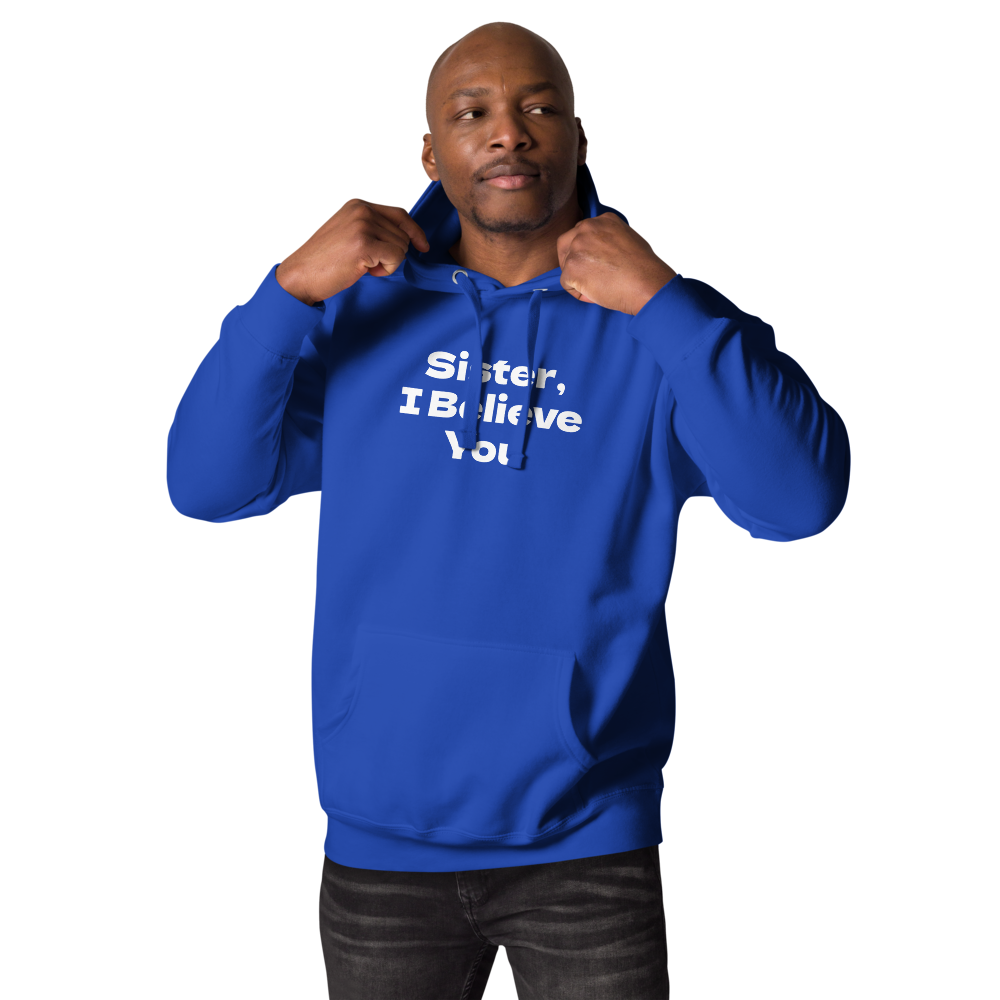 "Sister, I Believe You!" printed on a team royal unisex hoodie worn by a male