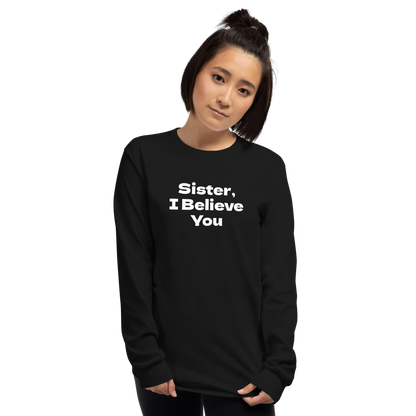 "Sister, I Believe You!" printed on a black men's long sleeve shirt worn by a female