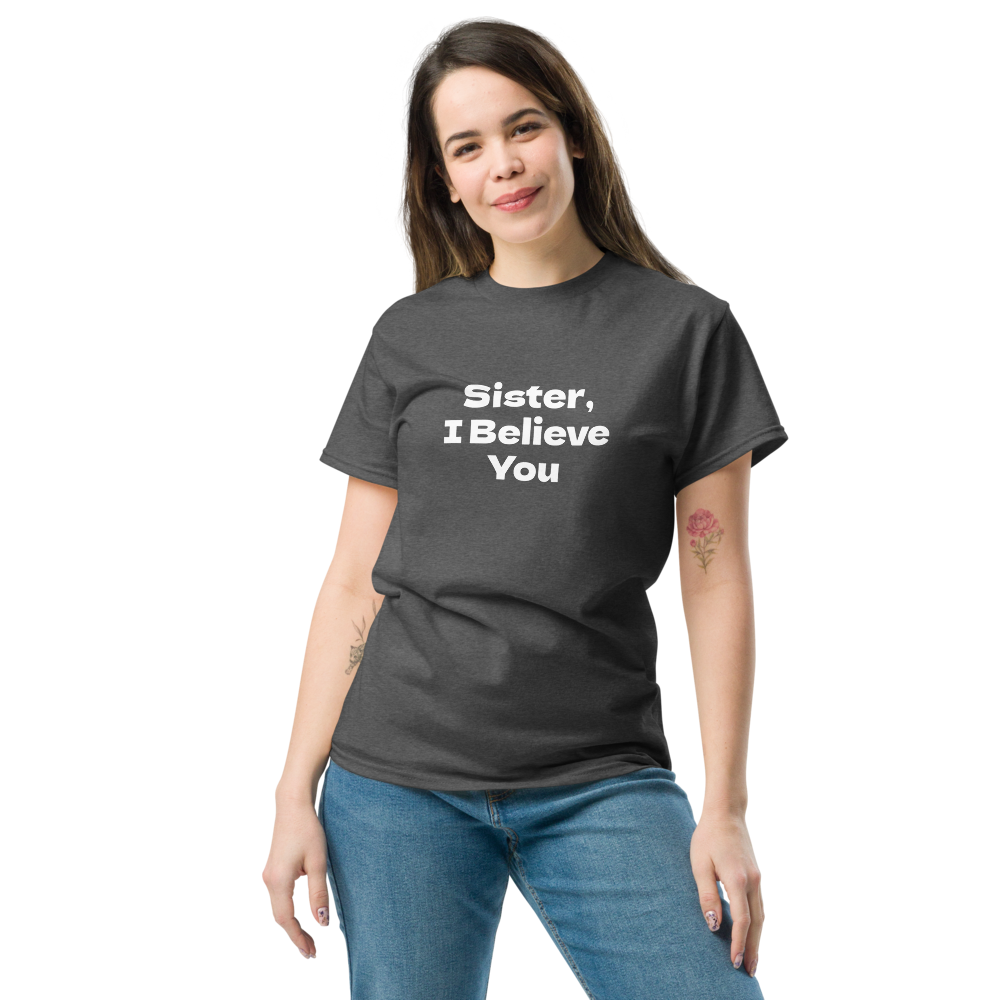 "Sister, I Believe You!" printed on a dark heather unisex classic tee worn by a female