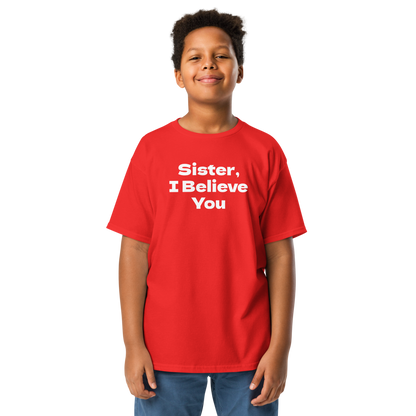 "Sister, I Believe You!" printed on a red youth classic tee worn by a male